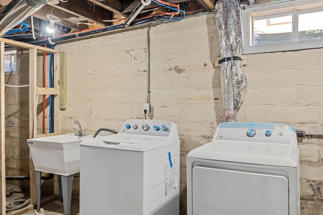 laundry area with separate washer and dryer and laundry area