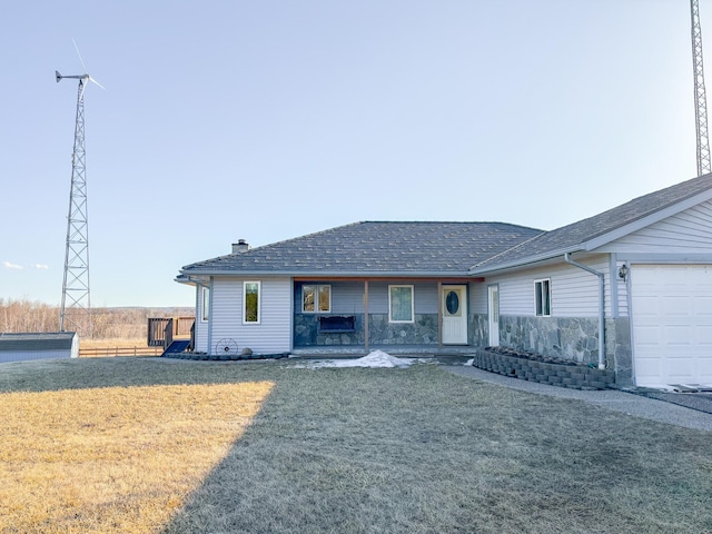 ranch-style home with a front yard, an attached garage, and a chimney