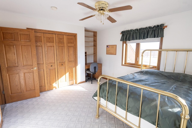 bedroom featuring a ceiling fan, light colored carpet, and a closet