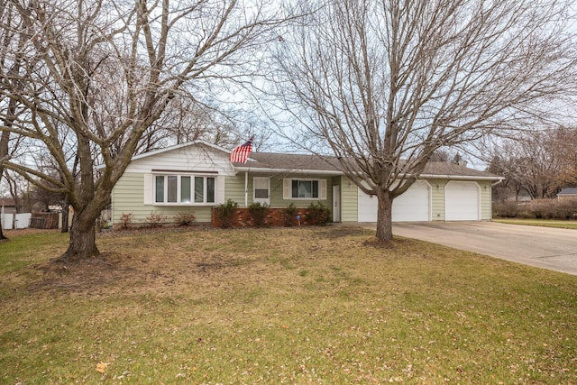 ranch-style house featuring a front lawn, concrete driveway, and an attached garage