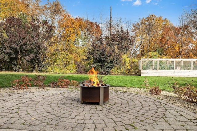 view of patio / terrace with an outdoor fire pit