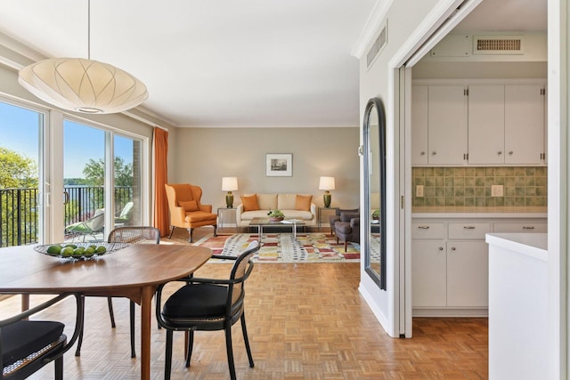 3200 Bde Maka Ska Pkwy Unit 302, Minneapolis, MN 55416 - dining space featuring crown molding
