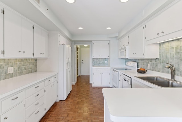 3200 Bde Maka Ska Pkwy Unit 302, Minneapolis, MN 55416 - kitchen with a sink, white appliances, decorative backsplash, recessed lighting, and white cabinetry