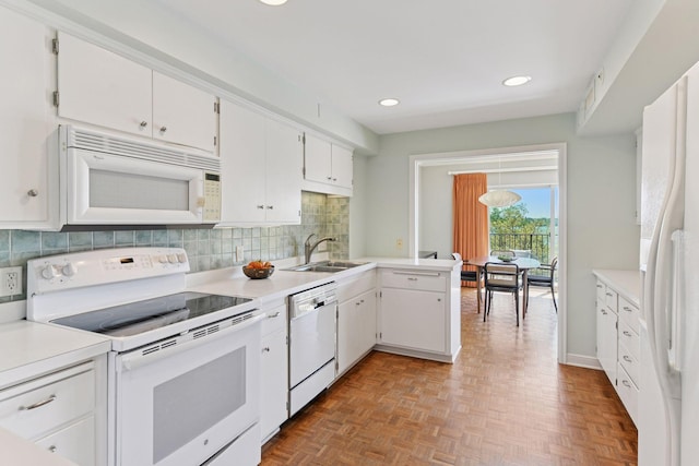 3200 Bde Maka Ska Pkwy Unit 302, Minneapolis, MN 55416 - kitchen with white appliances, a sink, white cabinets, backsplash, and recessed lighting
