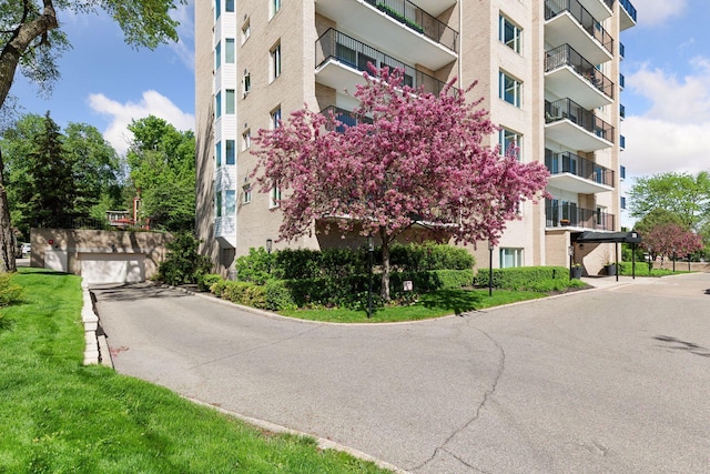 3200 Bde Maka Ska Pkwy Unit 302, Minneapolis, MN 55416 - view of apartment building / complex with a garage