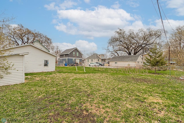 view of yard with fence and a residential view
