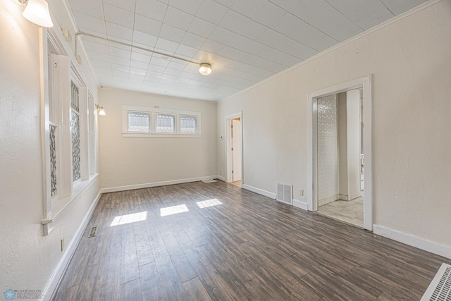1524 1st Ave S, Fargo, ND 58103 - spare room with wood finished floors, ornamental molding, and baseboards