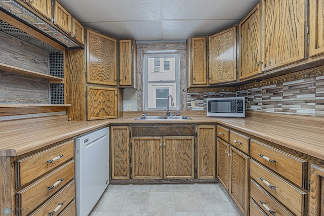 1524 1st Ave S, Fargo, ND 58103 - kitchen featuring stainless steel microwave, dishwasher, a sink, and wood counters