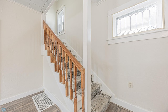 1524 1st Ave S, Fargo, ND 58103 - stairs with wood finished floors, plenty of natural light, and baseboards
