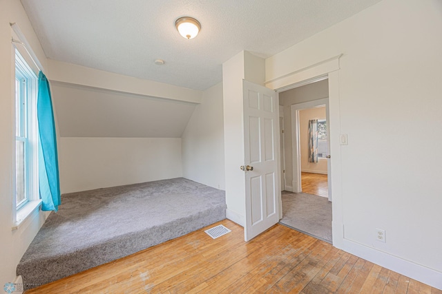 1524 1st Ave S, Fargo, ND 58103 - bonus room featuring hardwood / wood-style floors and lofted ceiling