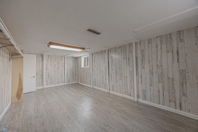 1524 1st Ave S, Fargo, ND 58103 - empty room featuring wood finished floors, a textured ceiling, and baseboards