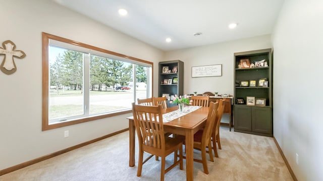 1001 Call Pl, Little Falls, MN 56345 - dining space with light colored carpet, baseboards, and recessed lighting