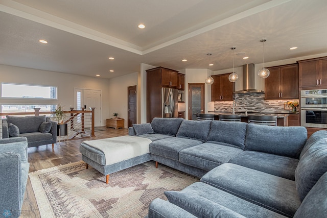 living room with recessed lighting and light wood finished floors