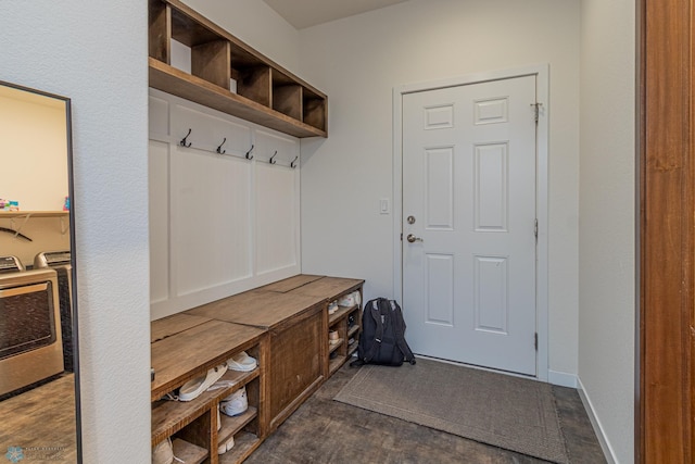 mudroom featuring washer / clothes dryer, baseboards, and dark wood-style flooring