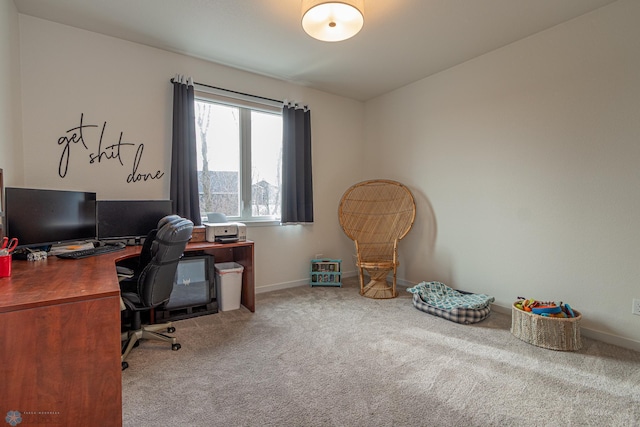 carpeted home office with baseboards