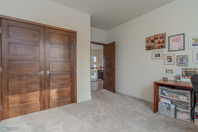 bedroom with baseboards and carpet flooring