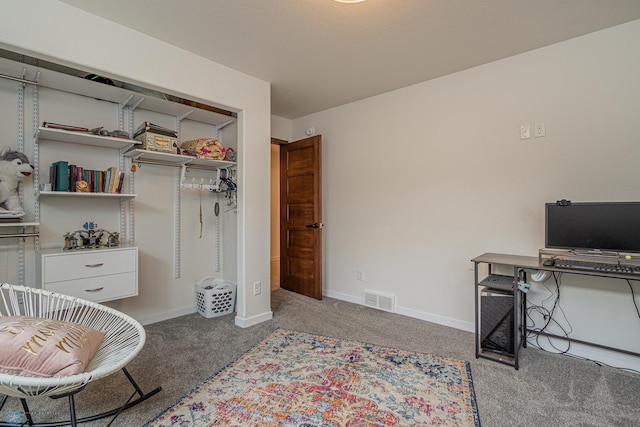 carpeted bedroom with baseboards, visible vents, and a closet