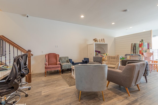 living room featuring recessed lighting, light wood-style flooring, and baseboards