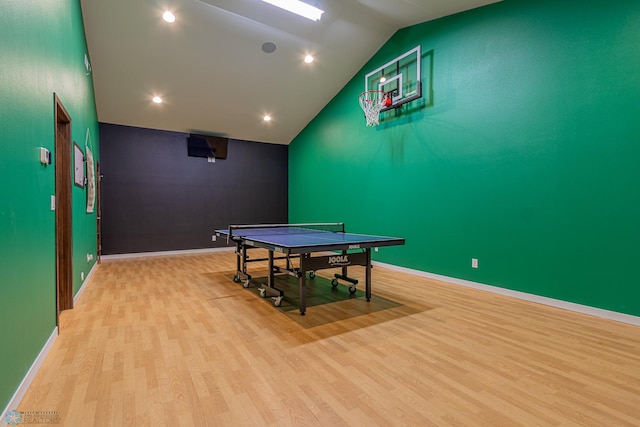 recreation room with recessed lighting, baseboards, lofted ceiling, and wood finished floors