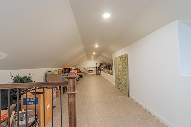 bonus room featuring lofted ceiling, recessed lighting, and baseboards