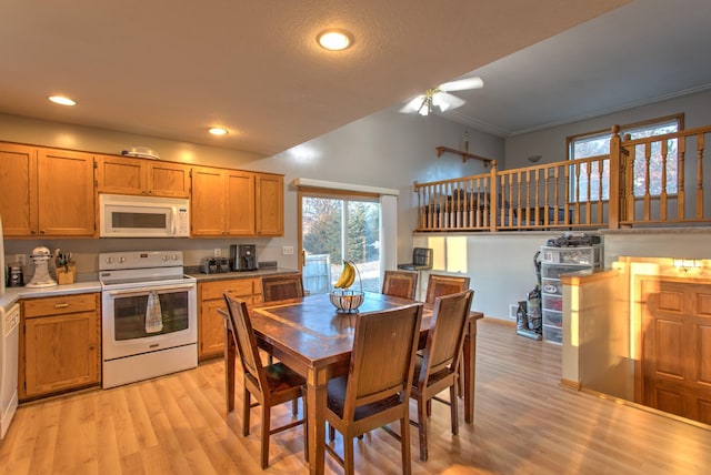 kitchen with brown cabinets, light wood-style flooring, recessed lighting, white appliances, and ceiling fan