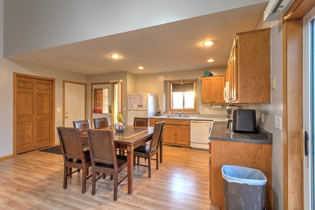 dining room with recessed lighting and light wood-style floors