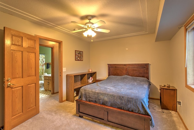 bedroom with light colored carpet, a ceiling fan, and baseboards