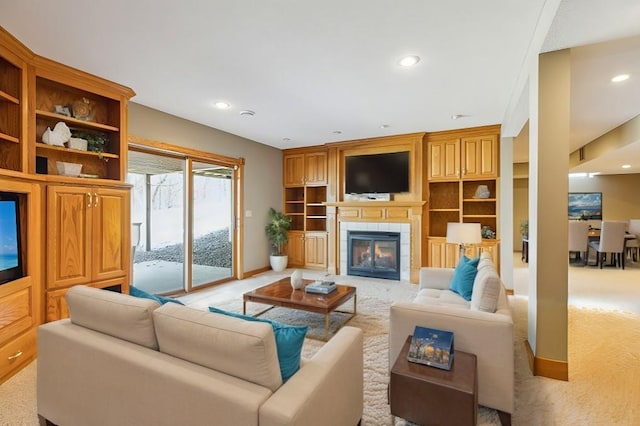 living area with a fireplace, recessed lighting, light colored carpet, and baseboards