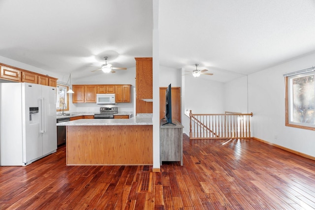 kitchen featuring appliances with stainless steel finishes, light countertops, a ceiling fan, and vaulted ceiling