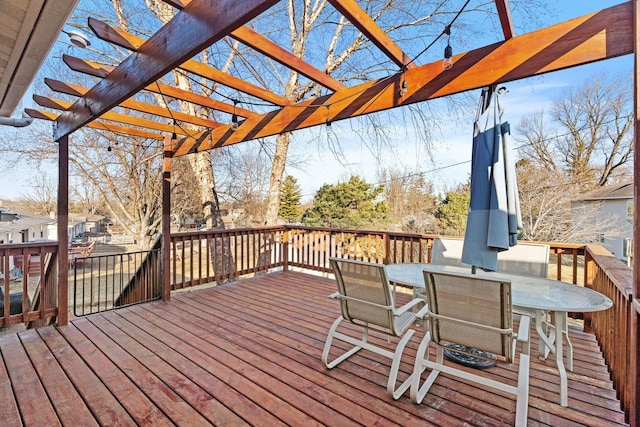 deck with outdoor dining space and a pergola