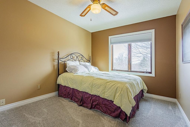 carpeted bedroom with a ceiling fan, lofted ceiling, and baseboards