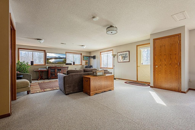 living area featuring baseboards and light colored carpet