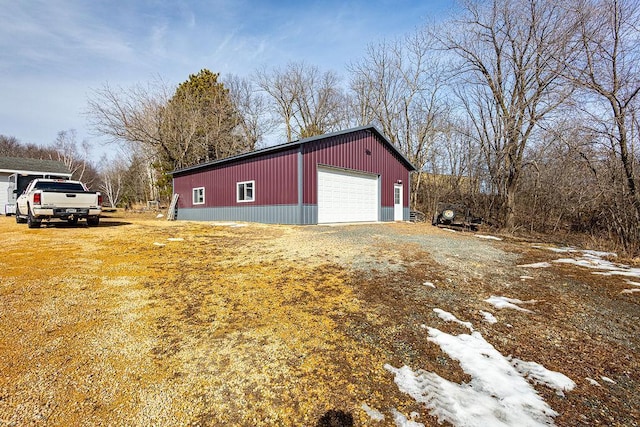 detached garage featuring driveway