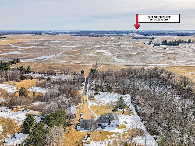 snowy aerial view featuring a rural view