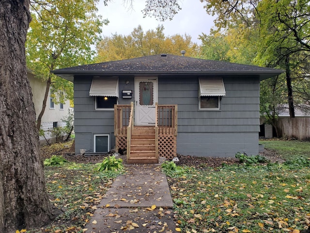 view of front of house featuring fence