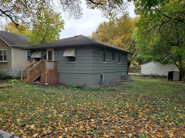 view of property exterior with a lawn