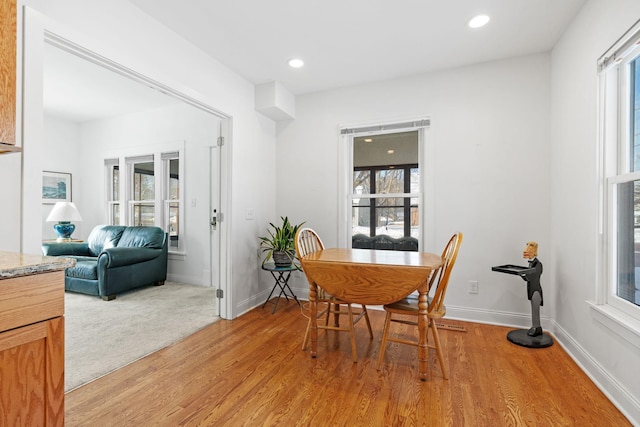 dining area featuring recessed lighting, baseboards, and light wood-style floors