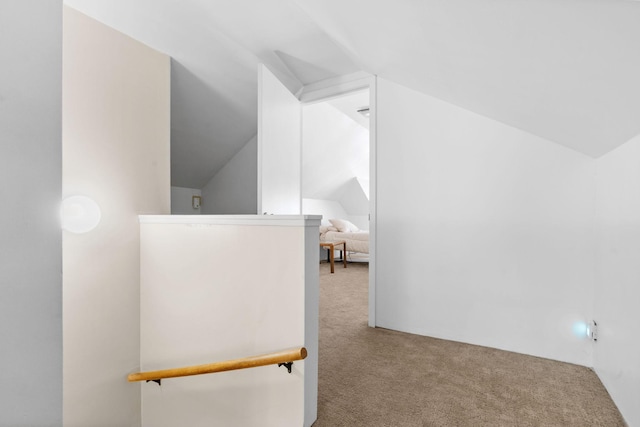 interior space featuring lofted ceiling and carpet floors