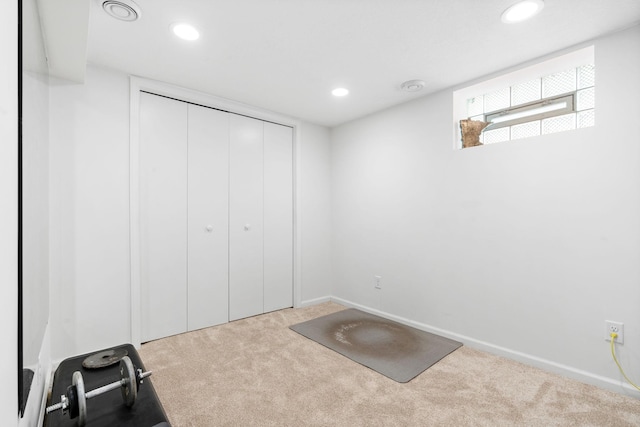 exercise room with recessed lighting, baseboards, and carpet floors