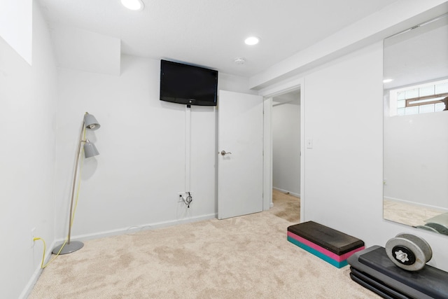 workout room with recessed lighting and carpet floors