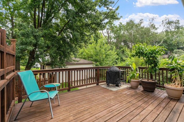 wooden terrace featuring grilling area