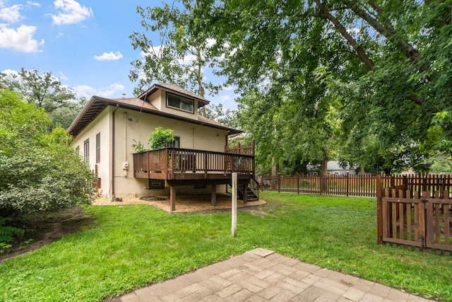 view of yard with a fenced backyard and a deck