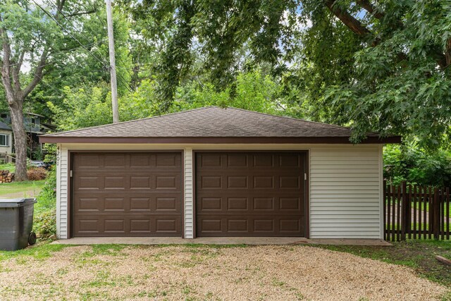 detached garage with fence