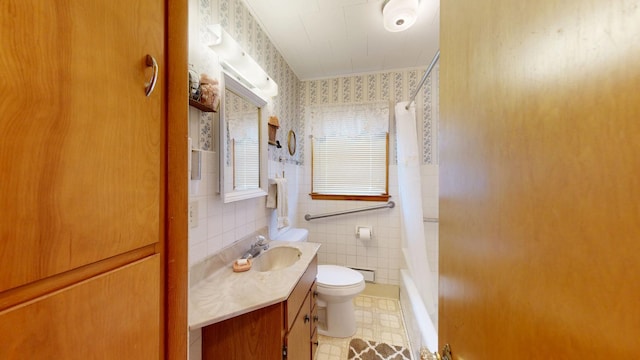 bathroom with tile patterned floors, toilet, tile walls, wallpapered walls, and vanity