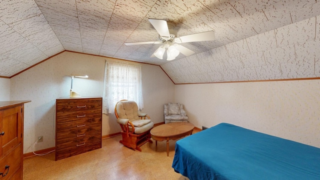 bedroom featuring baseboards, lofted ceiling, and a ceiling fan