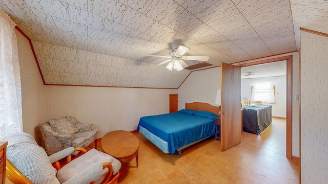 bedroom with tile patterned floors, a ceiling fan, and lofted ceiling