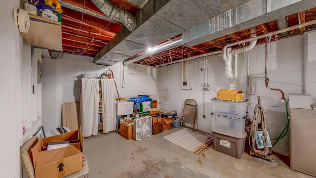 unfinished basement with washer / dryer