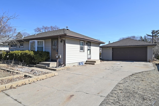 view of property exterior featuring a garage, an outbuilding, and a shingled roof