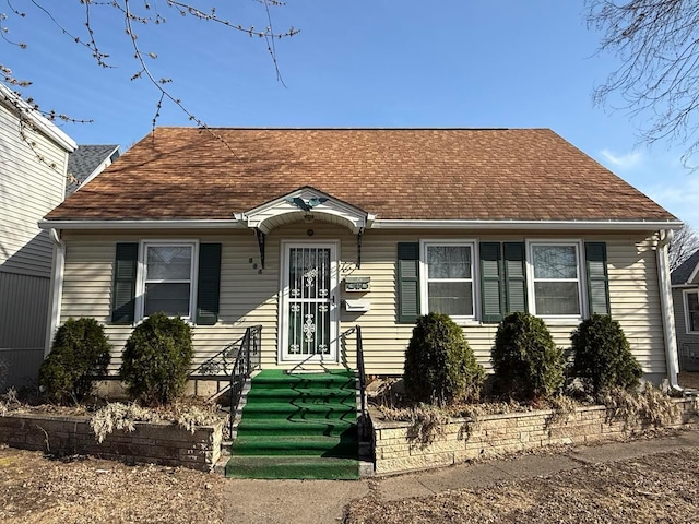 view of front facade with a shingled roof