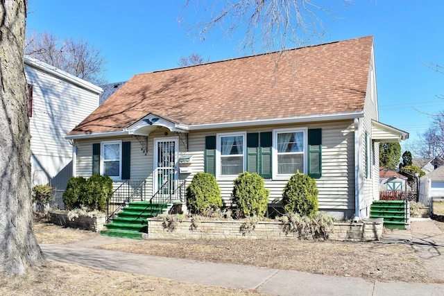 view of front of home featuring roof with shingles